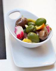 Olives in a small white bowl