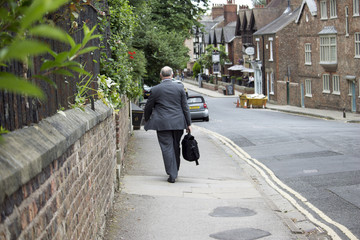Business Man Walking Down the Street in England