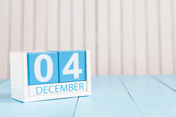December 4th. Day 4 of month, calendar on wooden workplace background. Winter time. Empty space for...