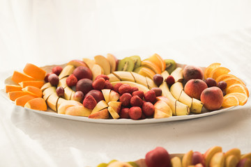 Various sweet sliced fruit on a buffet table