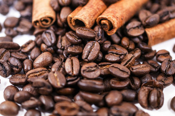 Coffee beans and Cinnamon on the white background - isolated