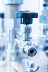 Valves on a laboratory bench.