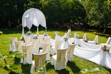 Wedding ceremony decorations in the park at sunny day