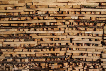 firewood in the stack, close-up. Wooden background.