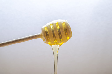 fresh honey with a stick