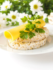 Rice puff cakes with cheese, parsley and chamomile