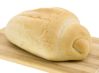 cutting wheat bread on a white background