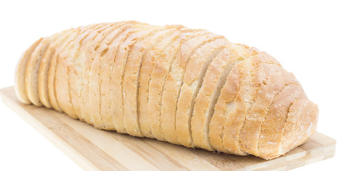 cutting wheat bread on a white background