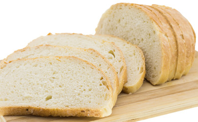 cutting wheat bread on a white background