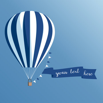 Hot air balloon with a banner on a blue background, striped hot air balloon with ribbon and flags flying in the sky