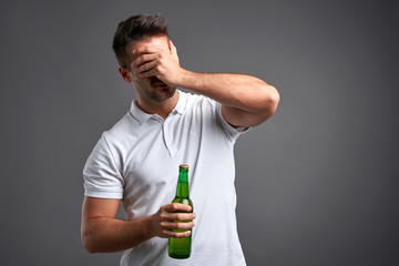 Young man with a beer