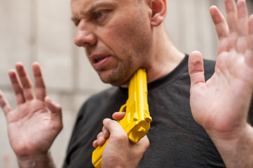 Kapap instructor demonstrates self defense techniques against a gun point. Gun Disarm.