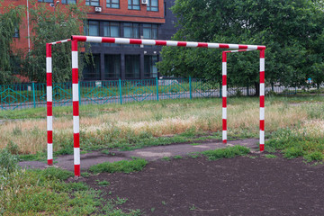 Fototapeta na wymiar Football goal in the school playground. Sport