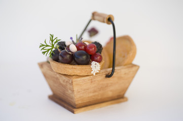 basket with red fruits pie