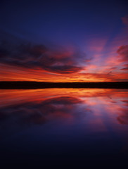Fototapeta na wymiar Sunset over a lake.
