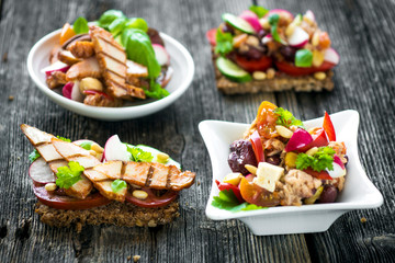 Delicious tapas on a wooden background