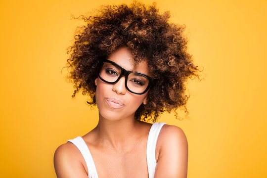 Girl with afro wearing eyeglasses, portrait.