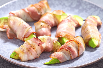 Roasted avocado pieces wrapped in bacon