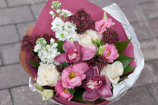 Bouquet of cream roses and orchids