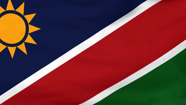 National flag of Namibia flying and waving on the wind. Sate symbol of Namibian nation and government. Computer generated animation.