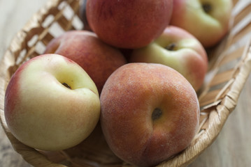 lay the peaches in a wicker basket