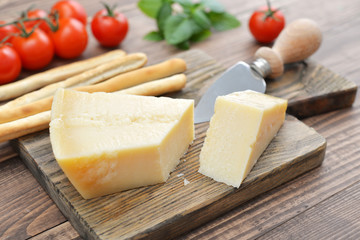 Parmesan cheese on cutting board