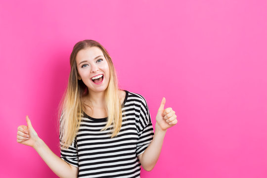 Happy Young Woman Giving Thumbs Up