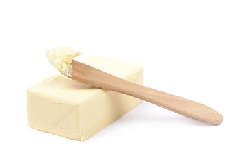 Knife over a piece of butter isolated