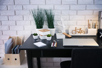 Workplace with laptop on table at home