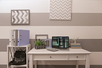Fototapeta premium Stylish workplace with laptop at home