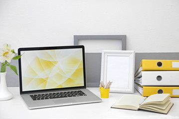 Stylish workplace with laptop at home, closeup