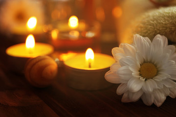 Beautiful spa set with flower on wooden table