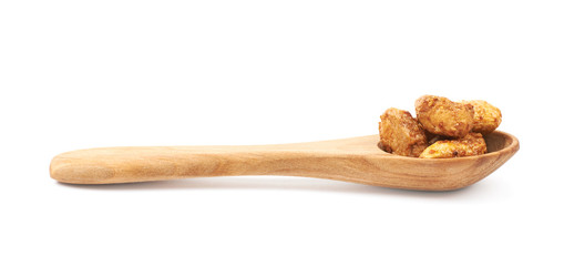 Spoon full of peanuts isolated