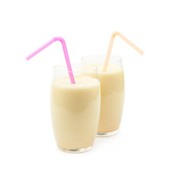 Two glasses of milkshake isolated