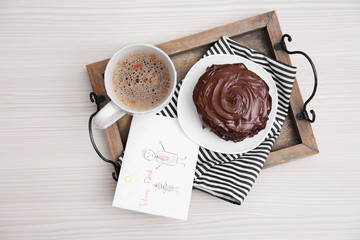 Chocolate pancakes with paint and coffee on table. Happy fathers day concept