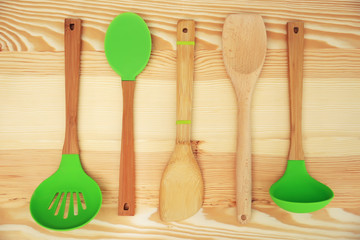 Kitchen utensil on wooden background