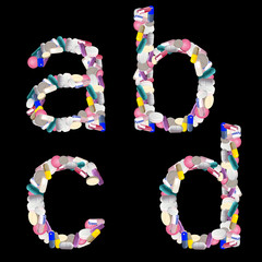 over black background medication colored alphabet letters from tablets and pills