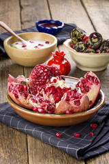 Ripe open pomegranate ( fruit of punica granatum )