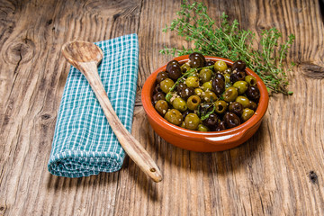 Bowl of olives with thyme