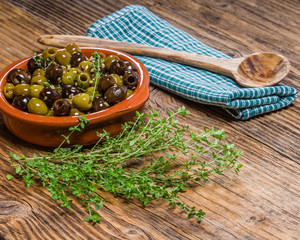 Bowl of olives with thyme