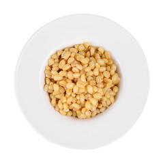 pile of pearl barley isolated on a white background.