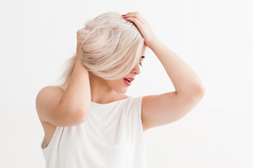 Fototapeta premium Blonde girl with bad hair. Bad condition of dyed hair, health and beauty concept