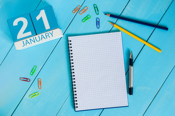 January 21st. Day 21 of month, calendar on teacher table background. Winter time. Empty space for text