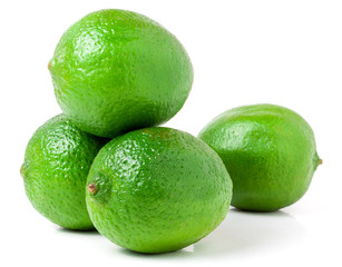 four lime isolated on white background close up