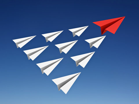 Red paper plane leads white paper planes in the blue sky leadership concept