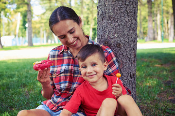 Happy joyful young family while having good time in the park
