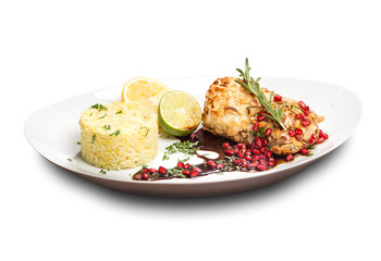 baked pork in almond chips with pomegranate lemon rice garnished with a sprig of rosemary.