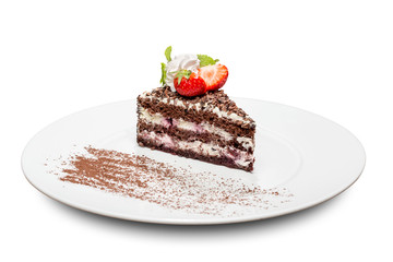 chocolate cake with cherries strawberries decorated with mint and whipped cream in a circular plate