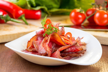 Beef jerky on a white plate