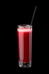 Berry cocktail in a glass with a straw. On a 